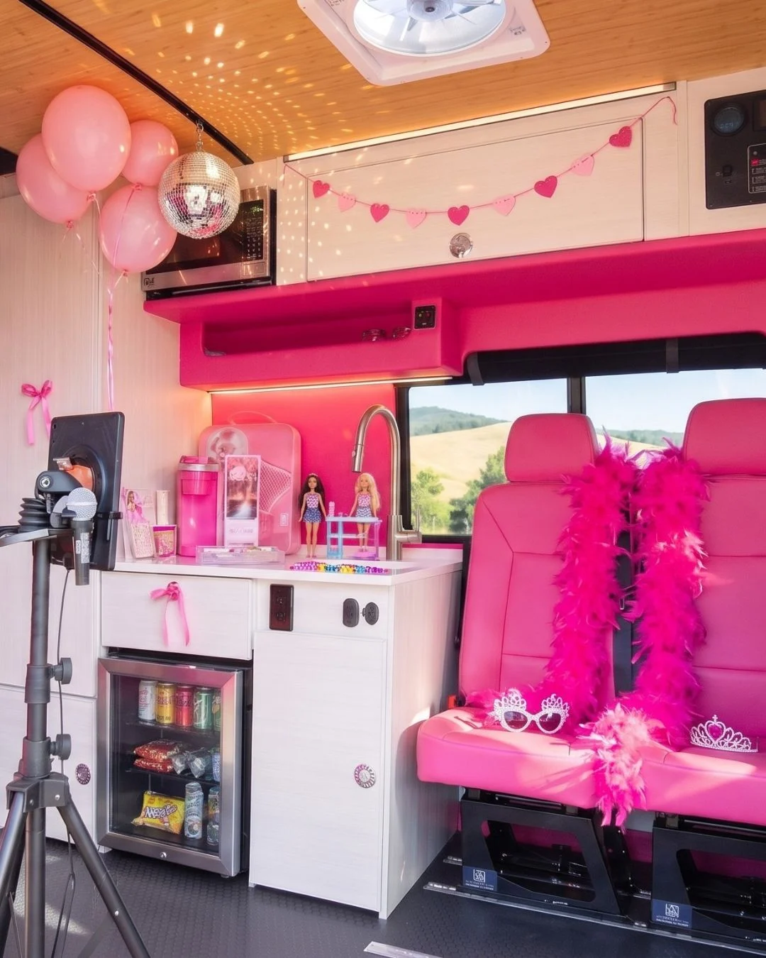 Dream Girl balloon and disco party setup inside the pink Dream Van