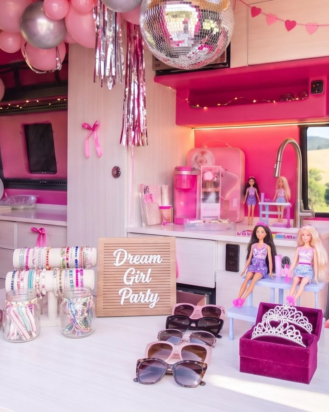 Dream Girl friendship bracelet and Barbie play stations inside the pink Dream Van