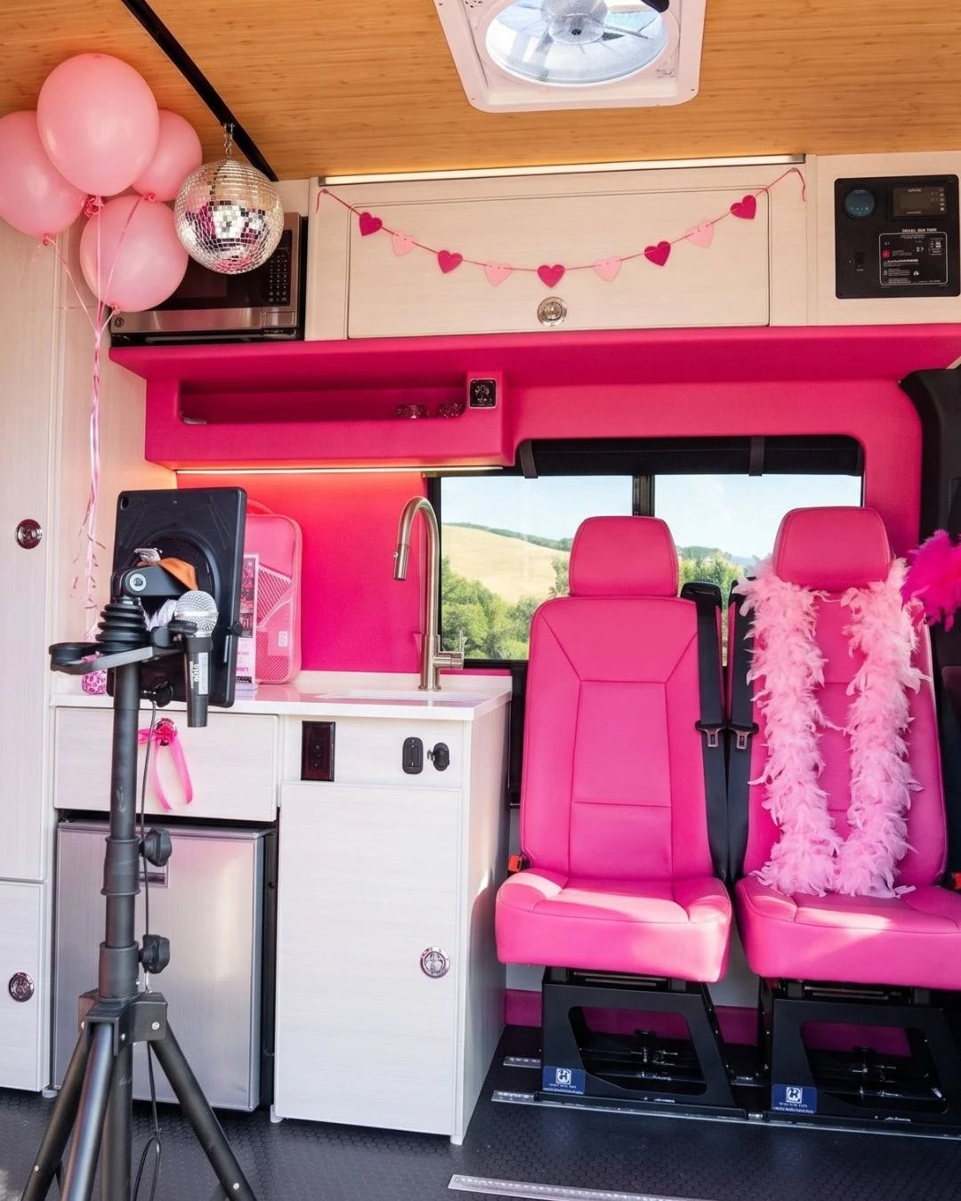 Dream Girl glam station and decorated party seating inside the Dream Van